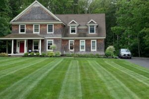 Lush new front lawn installation for a Maine home by Willie C. & Sons Landscaping.