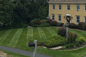 Fresh installation of a beautiful green lawn in a residential front yard by Willie C. & Sons Landscaping.
