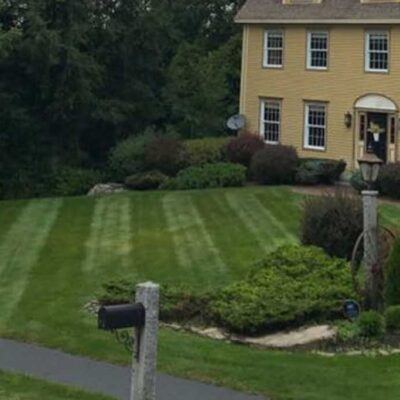 Fresh installation of a beautiful green lawn in a residential front yard by Willie C. & Sons Landscaping.